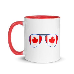 White ceramic coffee mug with a red handle and rim featuring a blue-framed aviator sunglasses graphic with Canadian flag maple leaf lenses.