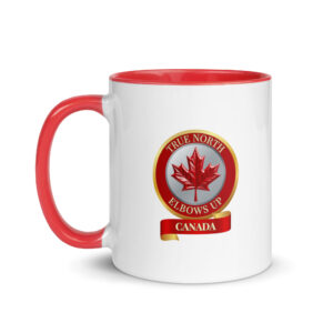 White ceramic coffee mug with a red handle and rim featuring a red and gold round medallion crest with a metallic red maple leaf, the text 'TRUE NORTH ELBOWS UP', and a red banner reading 'CANADA'.