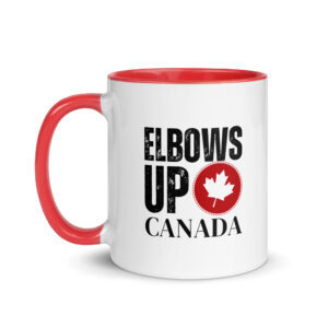 White ceramic coffee mug with a red handle and rim featuring distressed black text reading 'ELBOWS UP CANADA' alongside a circular red emblem badge with a white maple leaf.