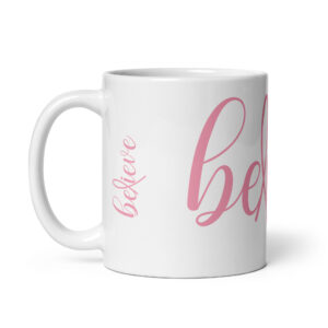 Believe Breast Cancer Awareness written in light pink script on a white ceramic mug.