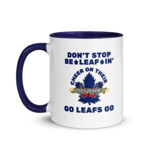 Two-tone blue accent ceramic coffee cup featuring a blue handle and interior, with text reading "DON'T STOP BE-LEAF-IN'", a blue maple leaf graphic, and "GO LEAFS GO".
