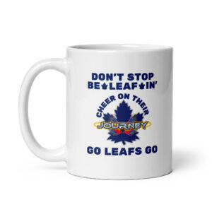 White ceramic coffee mug featuring blue text reading "DON'T STOP BE-LEAF-IN'", a blue maple leaf graphic with "JOURNEY", and "GO LEAFS GO" at the bottom.