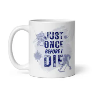 White ceramic coffee mug with a blue distressed graphic featuring hockey players, a maple leaf, and text reading "JUST ONCE BEFORE I DIE".