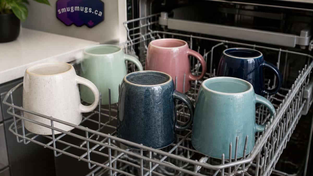 Diagram showing the correct top-rack placement to keep ceramic mugs dishwasher safe without touching.