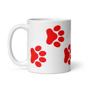 White ceramic coffee mug with red pet paw print design for pet lovers.