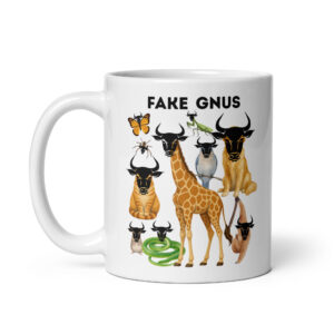 White ceramic coffee mug with cartoon gnus and animals, 'Fake Gnus' text.