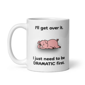 White ceramic coffee mug with a pig illustration and humorous text.